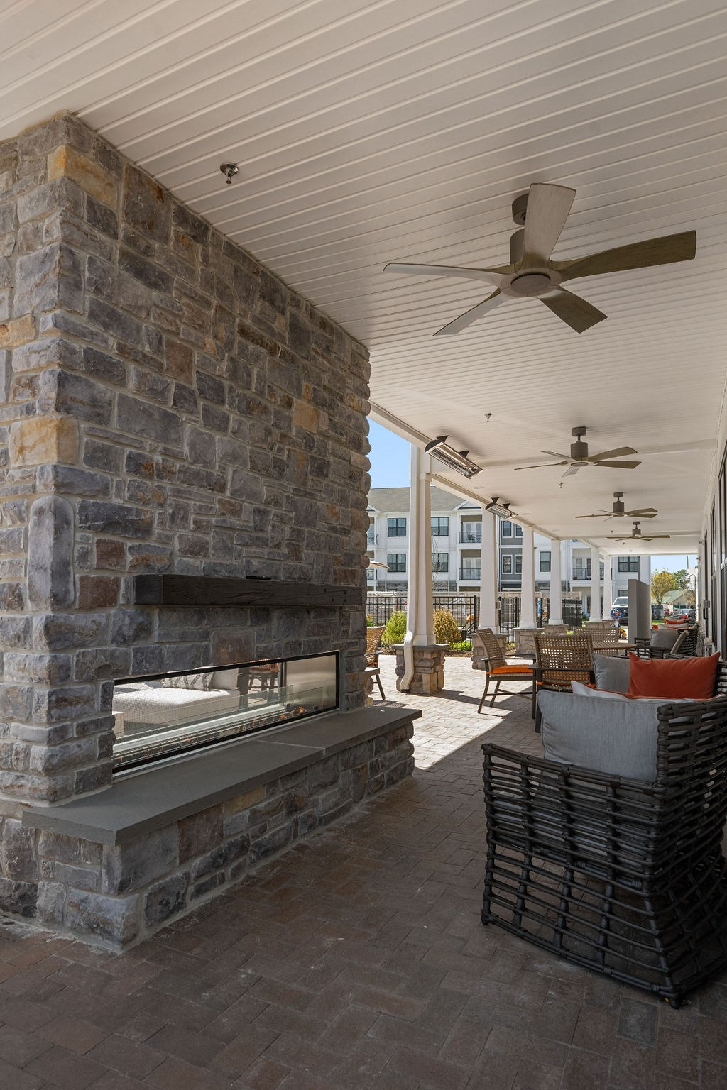 A patio with a stone fireplace and a ceiling fan at Madison Prickett Preserve, Pennsylvania