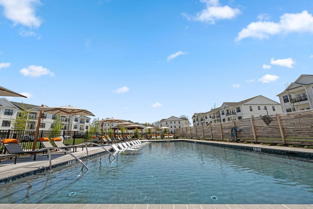 A swimming pool in front of a row of houses at Madison Prickett Preserve, Yardley, 19067