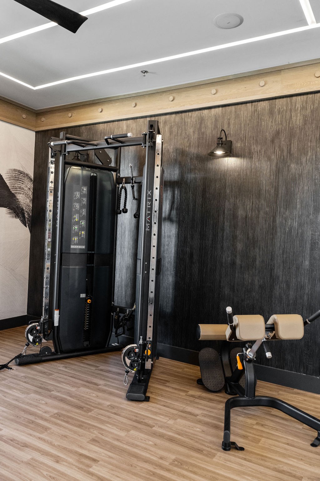 A gym with a wooden floor and a wall-mounted fan at Madison Prickett Preserve, Pennsylvania