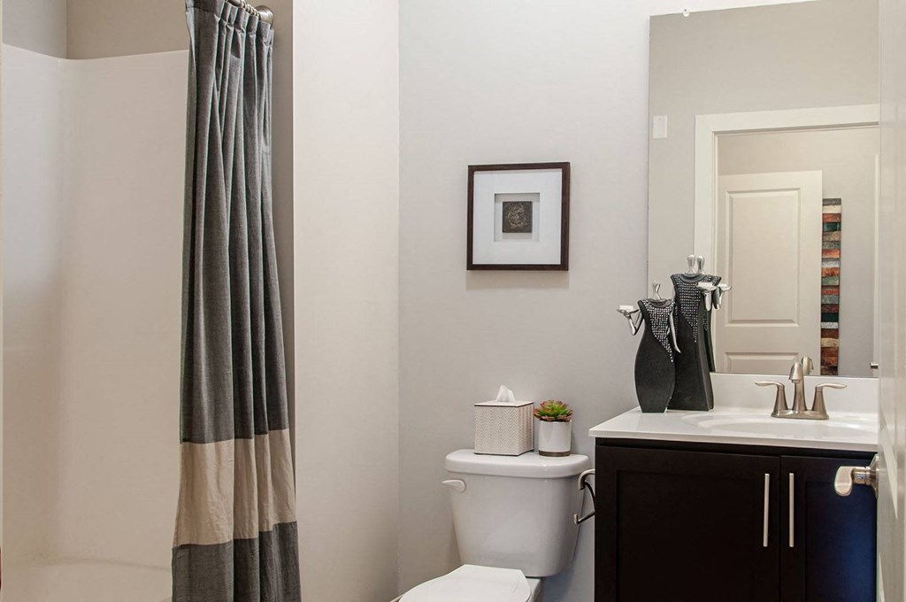 a bathroom with a toilet sink and shower in a 555 waverly unit  at Madison Providence, Collegeville, Pennsylvania