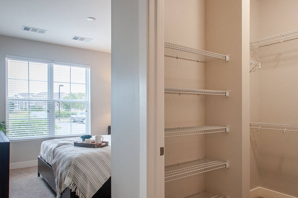a bedroom with a bed next to a window  at Madison Providence, Pennsylvania, 19426
