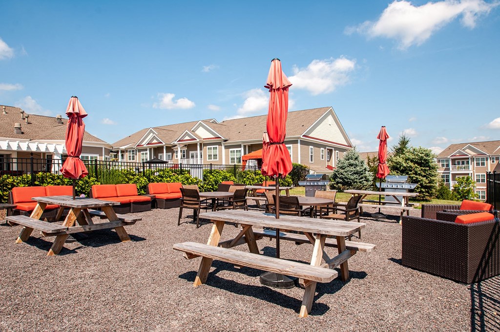 the reserve at bucklin hill patio with tables chairs and umbrellas  at Madison Providence, Collegeville, 19426
