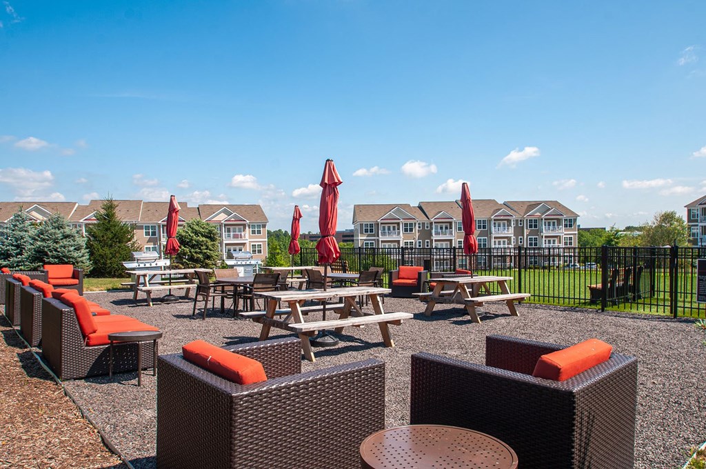 the reserve at bucklin hill patio with tables chairs and umbrellas  at Madison Providence, Pennsylvania