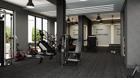 A fitness center with a variety of equipment and motivational quotes on the wall.