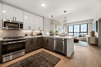 a kitchen with stainless steel appliances and a counter top at Madison West Elm, Conshohocken
