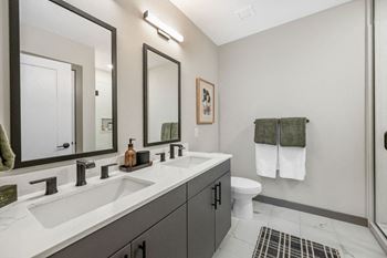 a bathroom with two sinks and a toilet at Madison West Elm, Pennsylvania