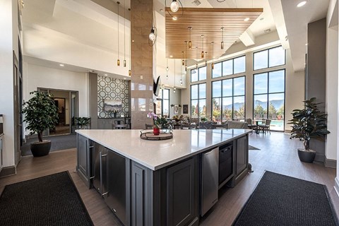 A modern kitchen with a large island and lots of counter space.