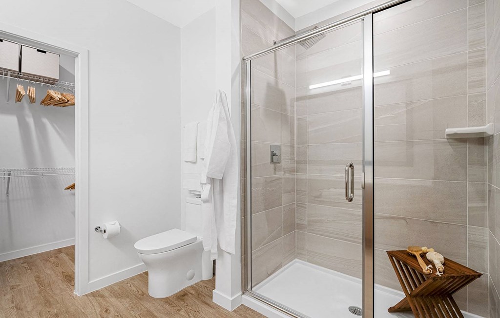 a white bathroom with a shower and a toilet at Madison Waterford Lakes, Orlando, 32826