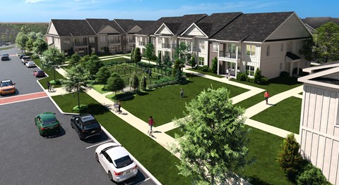 Aerial view of modern apartment buildings with landscaped green space, walking paths, and a fenced dog park.