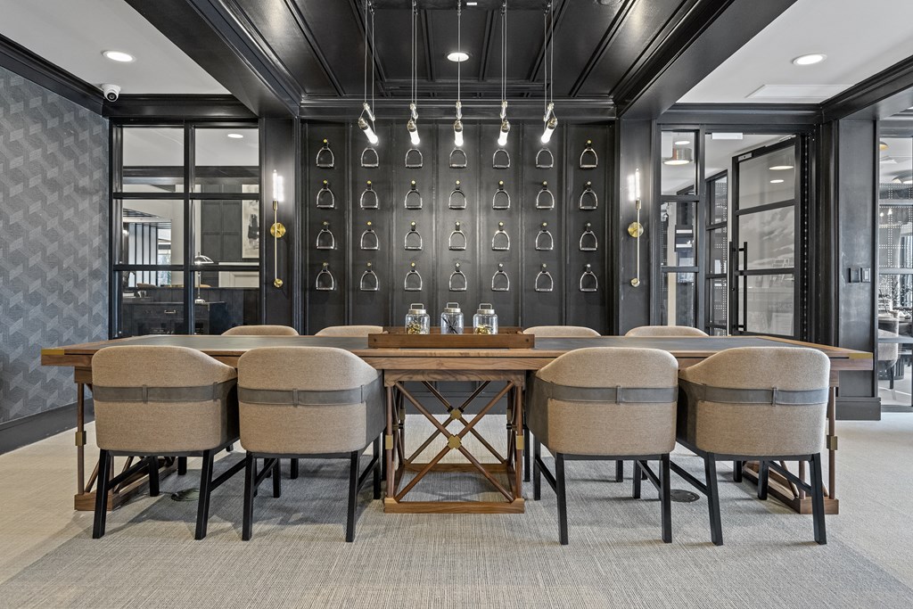 a large table and chairs in a room with glass doors at The Harrison, Newtown Square, PA