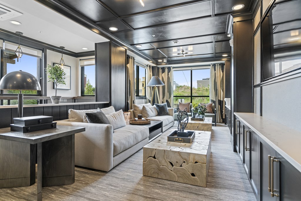 a living room filled with furniture and a large window at The Harrison, Newtown Square, 19073
