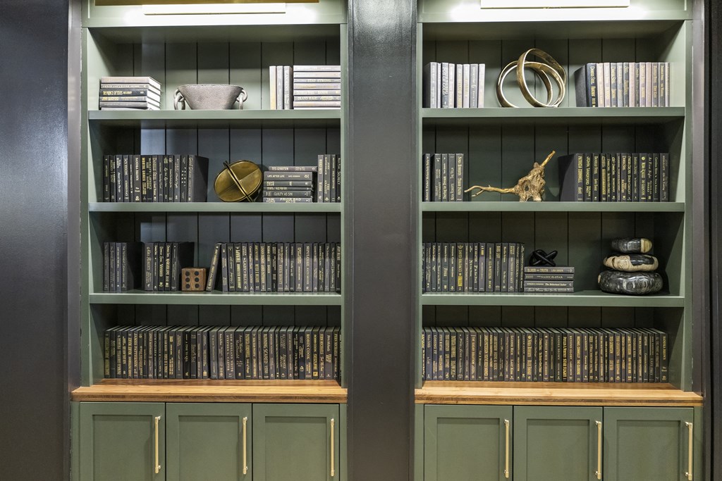 a bookshelf with books and other items on it at The Harrison, Pennsylvania, 19073