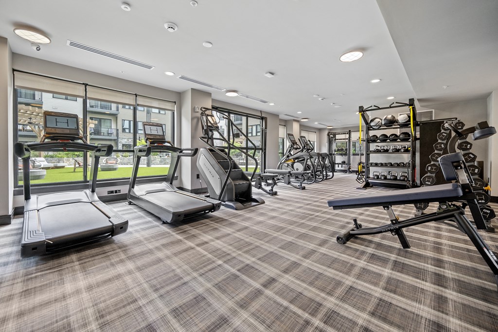 the gym at the enclave at woodbridge apartments in sugar land, tx at The Harrison, Newtown Square