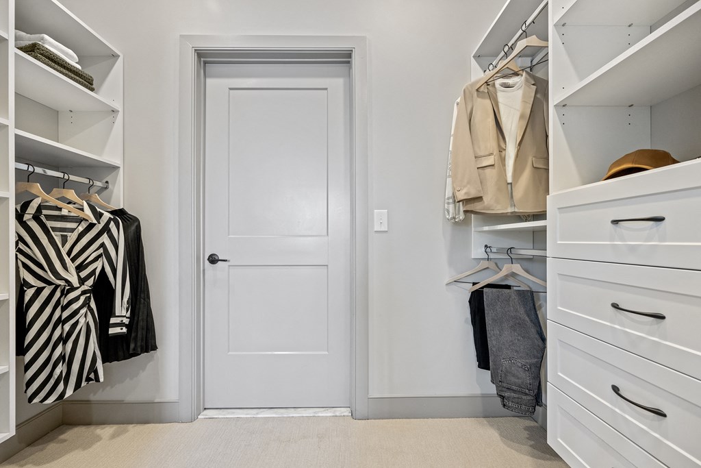 a small walk in closet with white cabinets and a white door at The Harrison, Newtown Square, PA, 19073