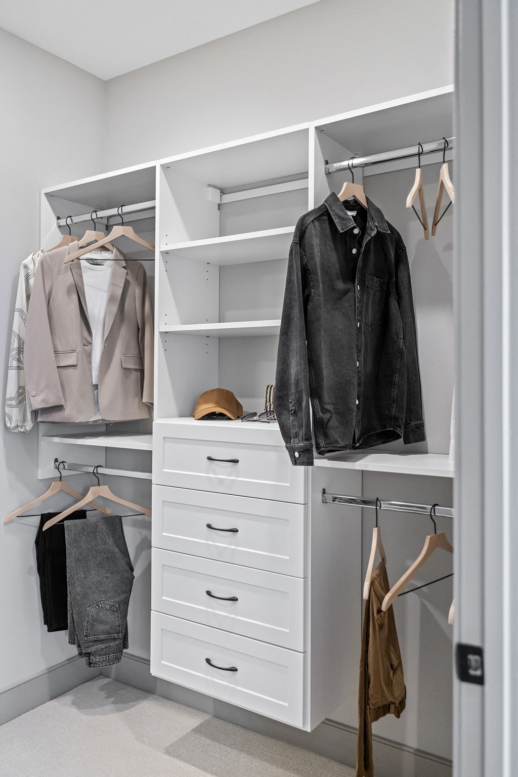 a white walk in closet with white drawers and shelves at The Harrison, Newtown Square, PA, 19073