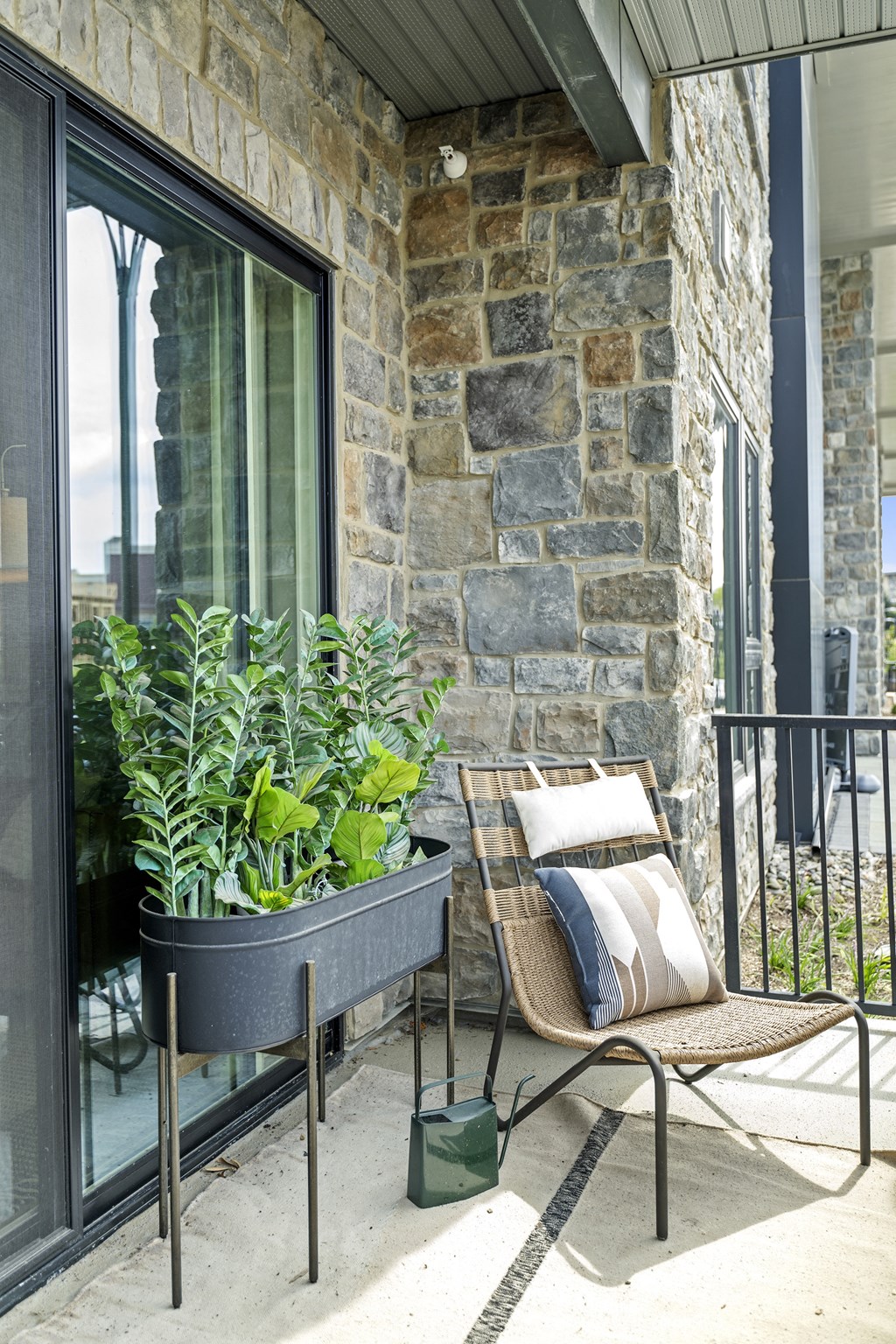 a patio with a chair and a potted plant at The Harrison, Pennsylvania