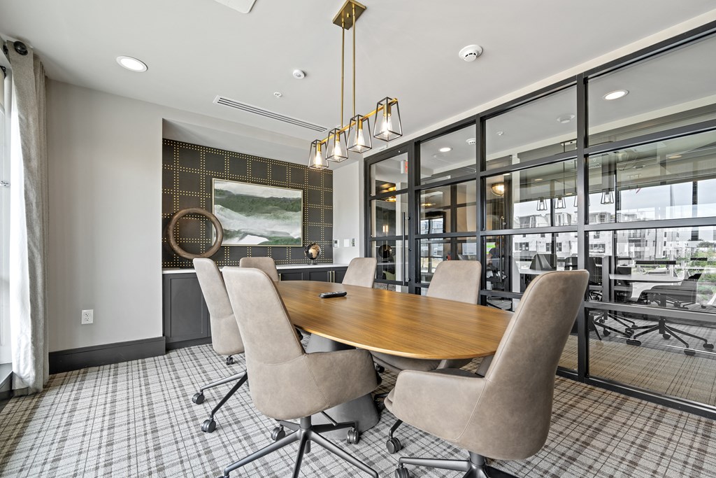 a meeting room with a large table and chairs at The Harrison, Newtown Square, PA, 19073