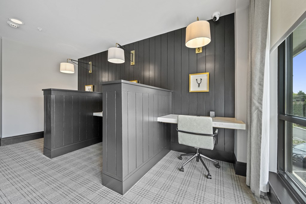 a room with a desk and chair in front of a window at The Harrison, Newtown Square, PA, 19073