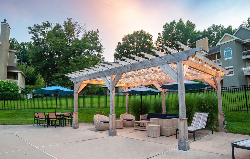 Pool cabana at dusk with the lights on at Madison Glen Mills, Glen Mills, 19342