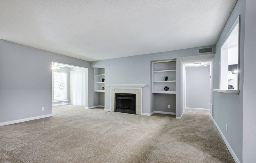 vacant renovated apartment-fireplace in living room at Laurel Oaks, North Carolina