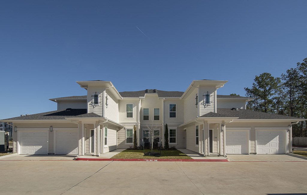 Townhome building with garages at The Parkway on Westlake, Humble, Texas