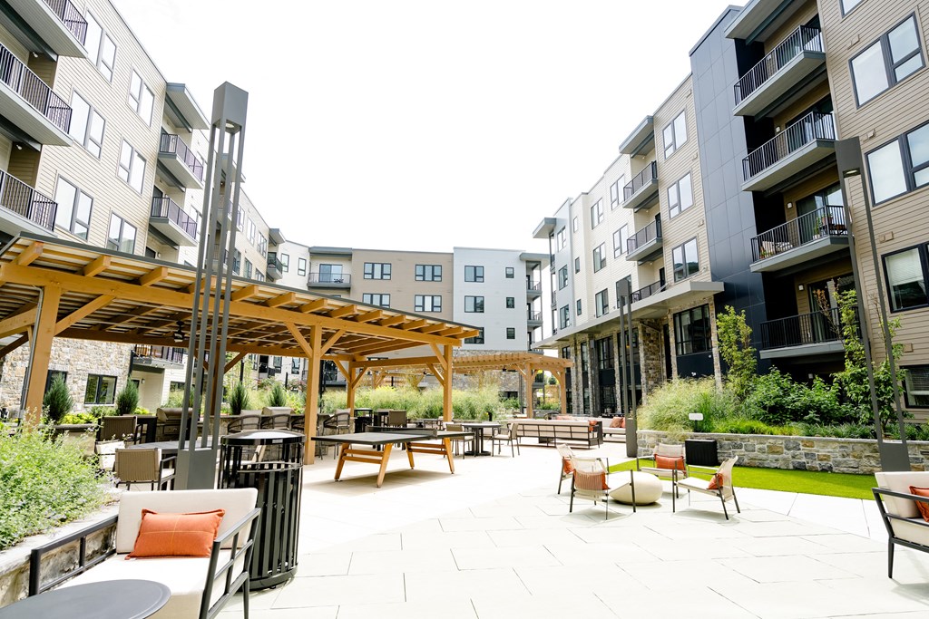 an outdoor patio area at the flats at big tex apartments in san antonio, tx at The Harrison, Pennsylvania, 19073
