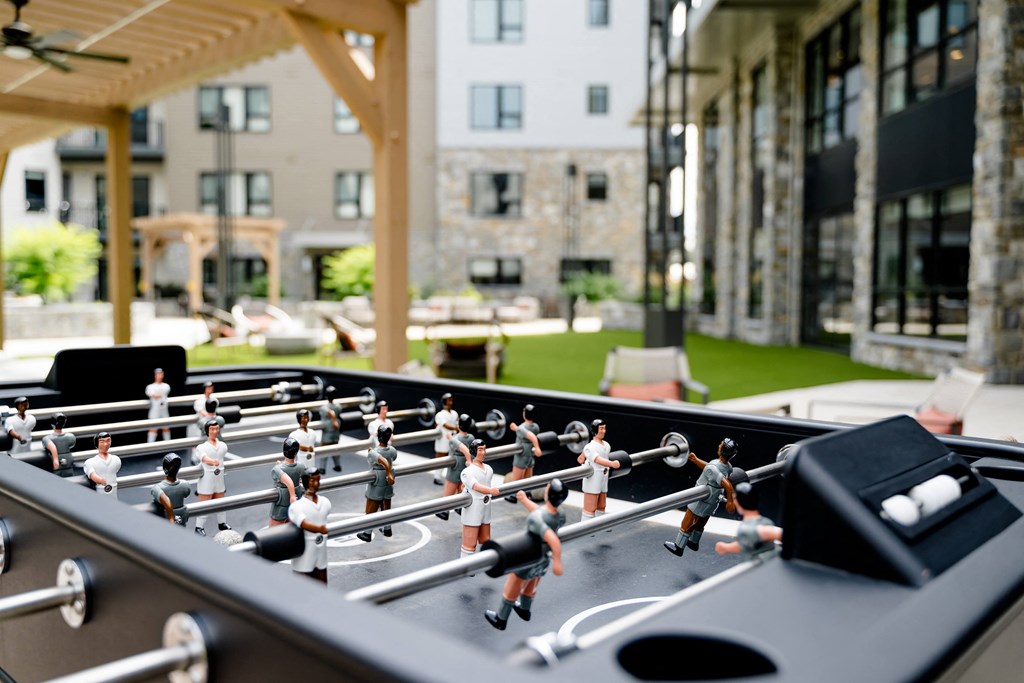 a foosball table in the common area of the residences at omni louisville at The Harrison, Newtown Square, Pennsylvania