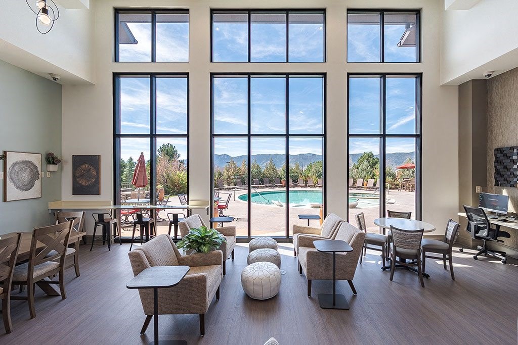 Clubhouse with view out of huge wall of windows Clubhouse with view out of huge wall of windows at Vistas at Jackson Creek, Monument, CO
