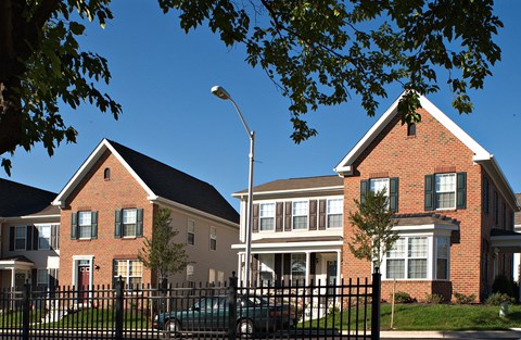 a pair of houses on a city street