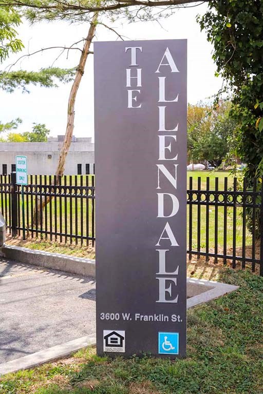 a sign that reads the alliance in front of a fence