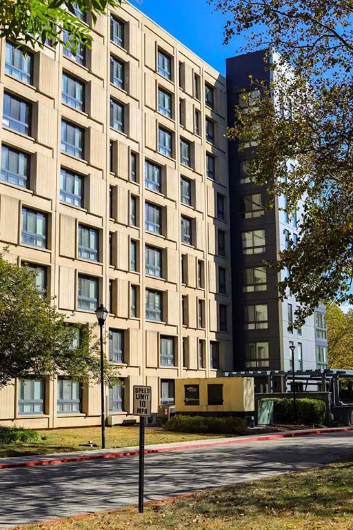 a tall building with a street in front of it