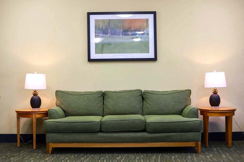 a living room with a couch and two lamps