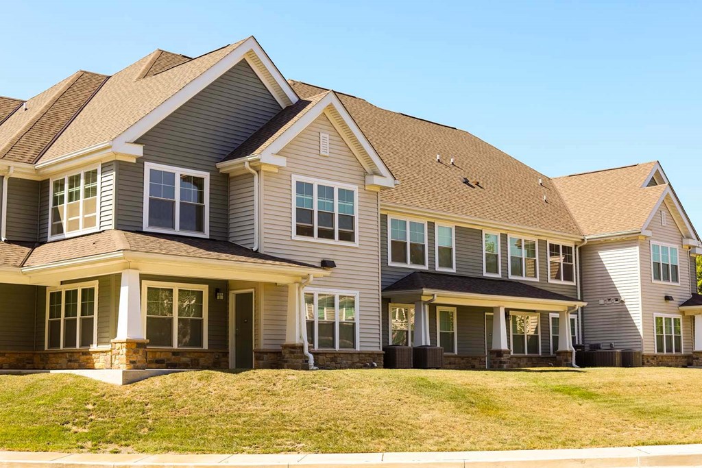 a large house with a yard in front of it