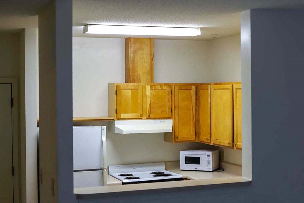 a kitchen with a stove and a microwave