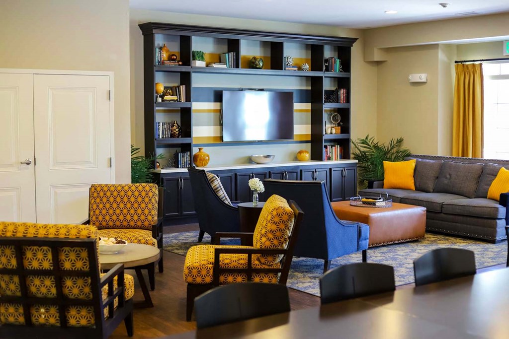 a living room with a couch and chairs