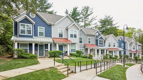 A row of houses with blue and grey exteriors.