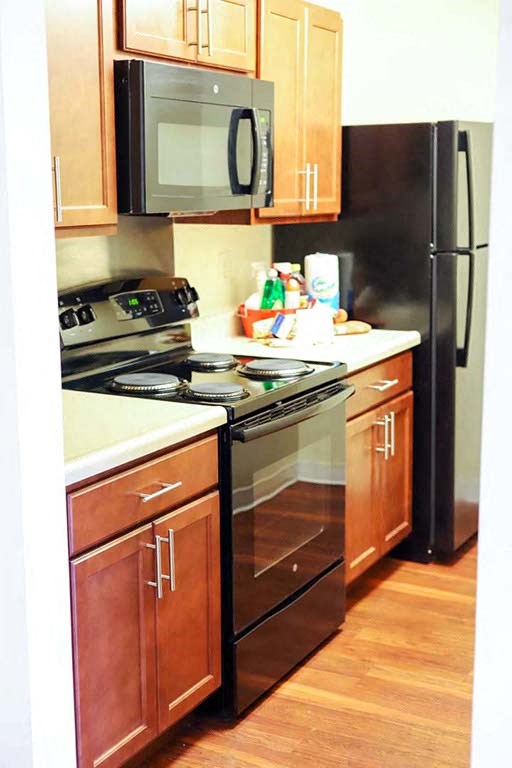 a kitchen with a stove and a refrigerator