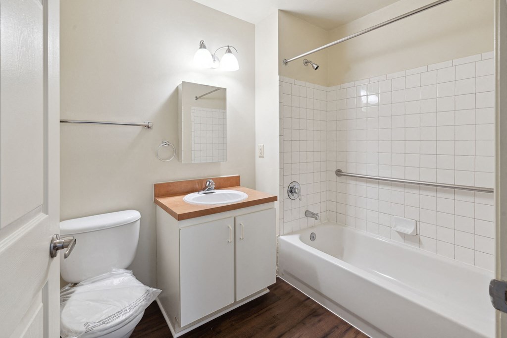 a bathroom with a toilet sink and bathtub