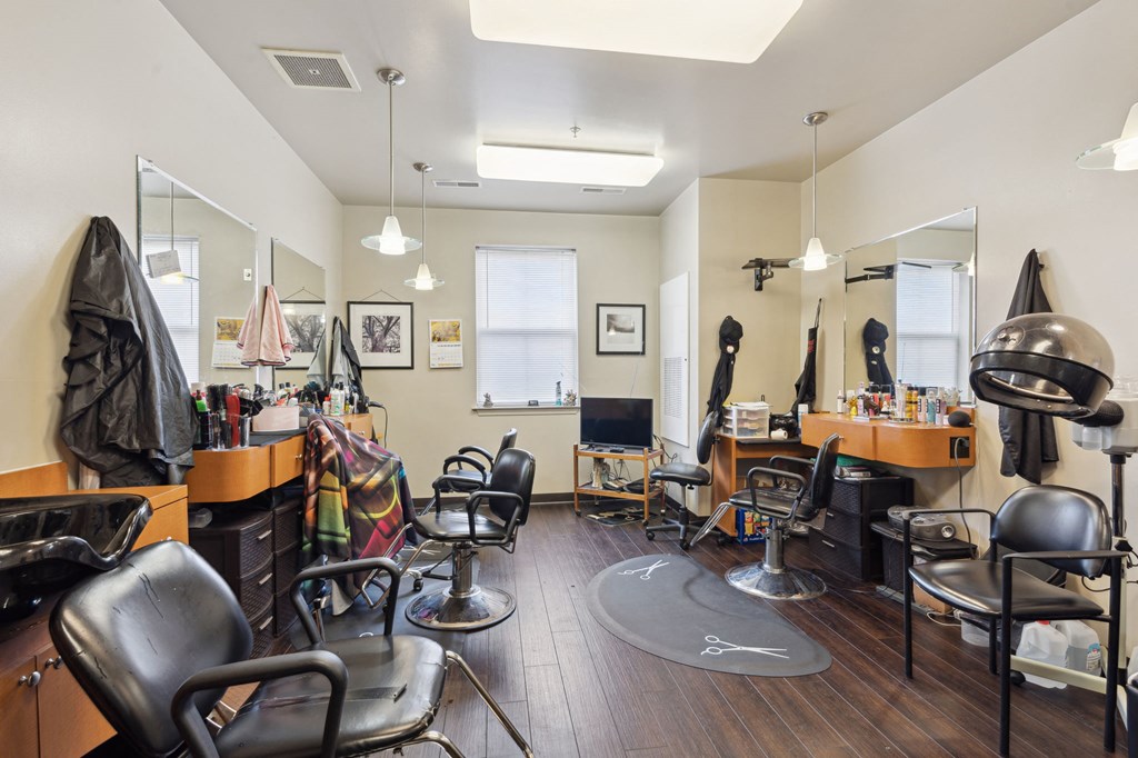 a salon room with chairs and mirrors