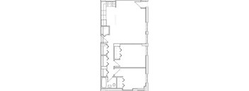 A floor plan of a building with multiple rooms and corridors.