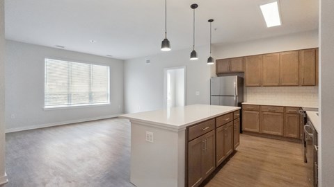 A kitchen with wooden cabinets and a white countertop.
