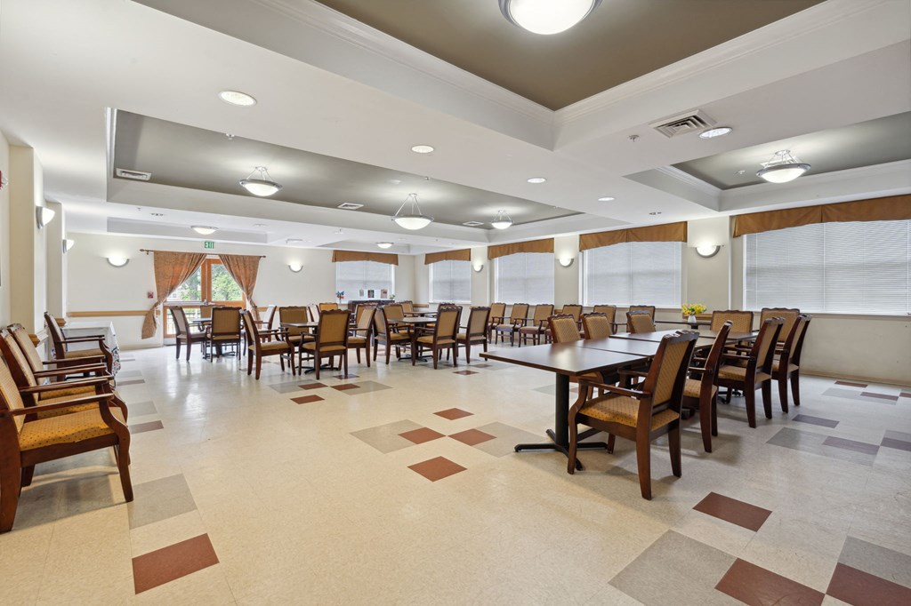 a large dining room with a large table and chairs