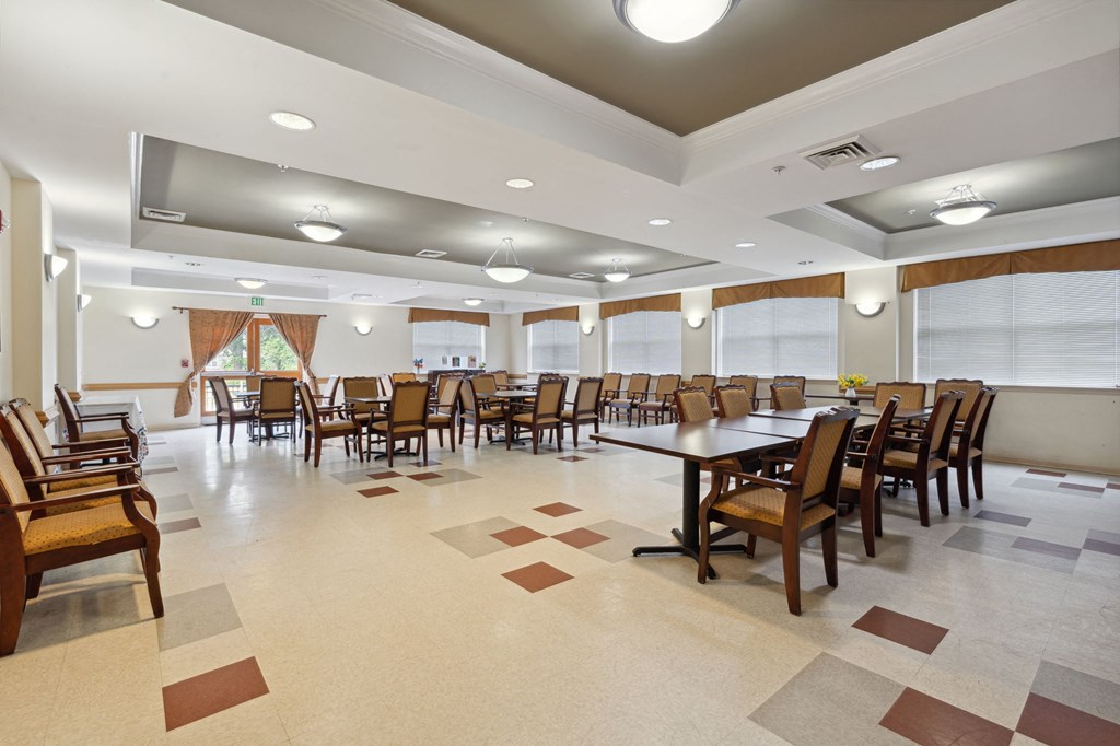 a large dining room with a large table and chairs