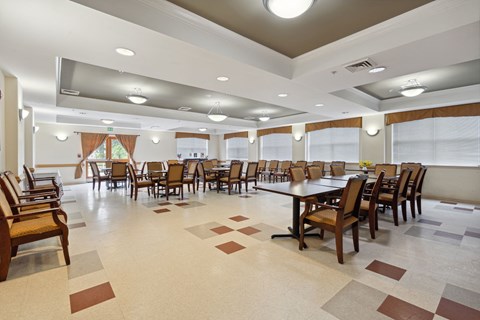 a dining room with tables and chairs in a hall