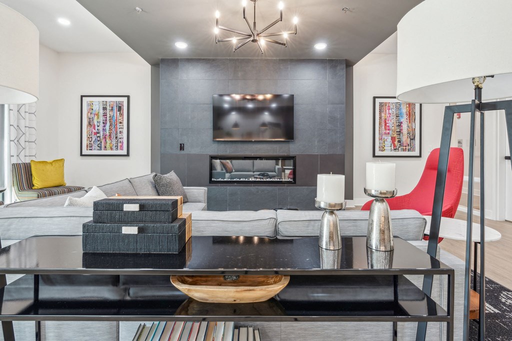 Legacy at Twin Rivers community room with a couch and a coffee table and a fireplace