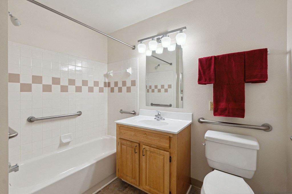 a bathroom with a sink toilet and bathtub