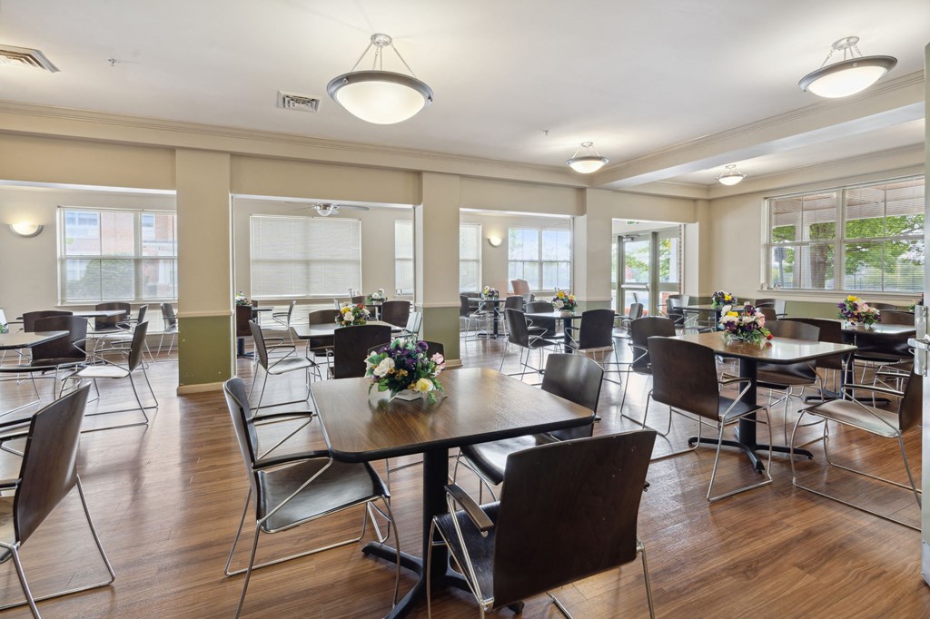a large dining room with tables and chairs