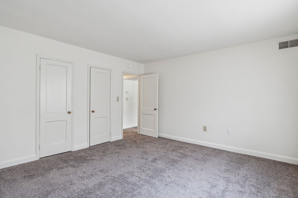 Senior-friendly bedroom at Park View at Towson with two doors and natural light