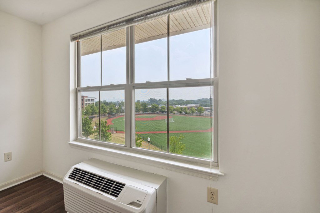 a large window with a view of a baseball field