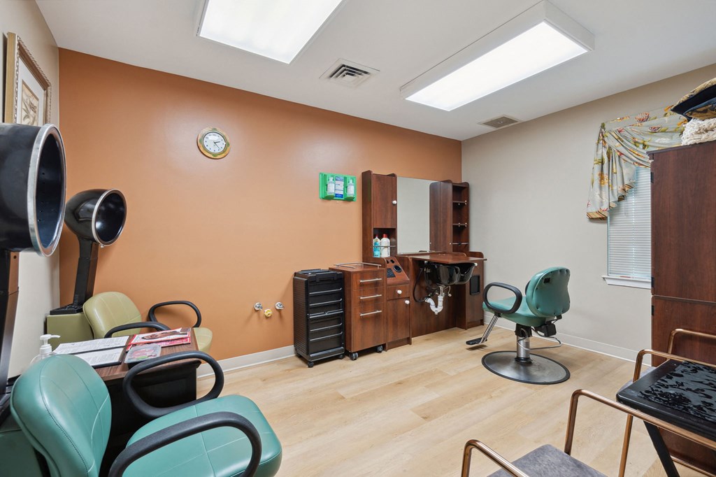 a treatment room with chairs and a desk